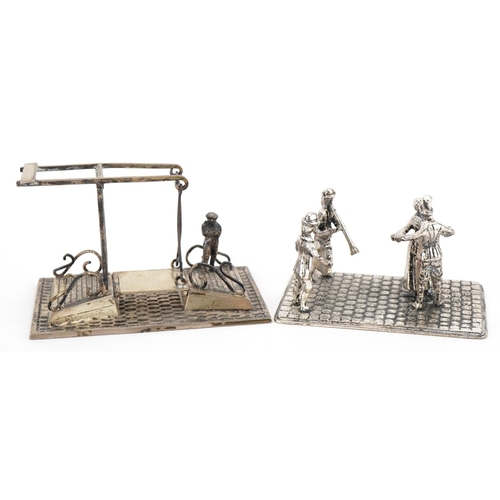 1851 - Two miniature Dutch silver models of figures dancing and a figure waiting to cross a bridge, the lar... 