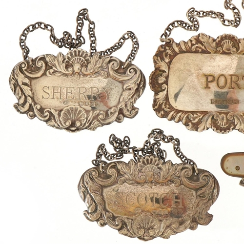 1824 - Four silver decanter labels and a silver and mother of pearl folding pocket knife, the largest 7cm i... 