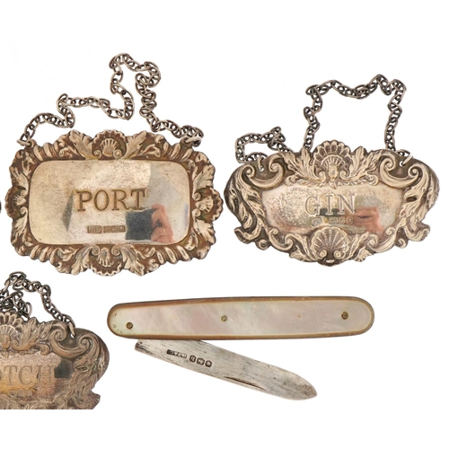 1824 - Four silver decanter labels and a silver and mother of pearl folding pocket knife, the largest 7cm i... 