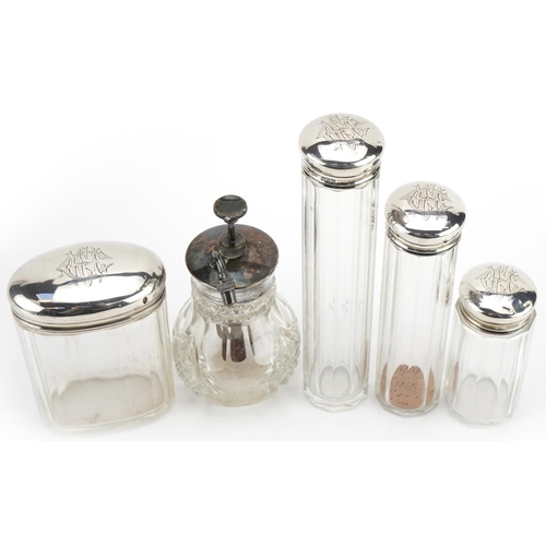 1847 - Four cut glass jars with silver lids and a Victorian cut glass atomiser with silver coloured metal l... 