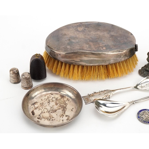 1874 - Silver and white metal objects including a silver backed clothes brush, thimbles, teaspoons and a Si... 