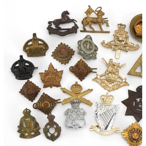 1768 - Military interest cap badges and buttons including On War Service and Royal Irish Rangers