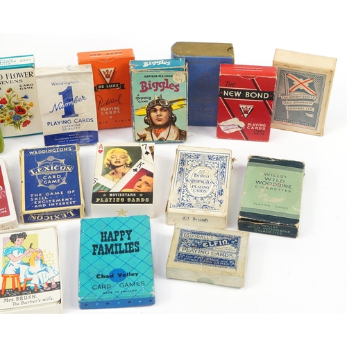 1454 - Twenty packets of vintage and later playing cards, some sealed, including Lexicon, Biggles and The U... 