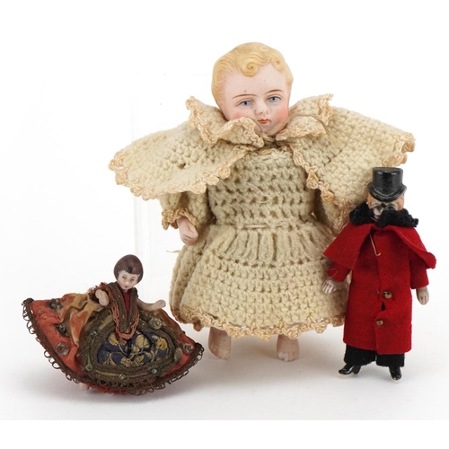 1456 - Three miniature bisque dolls with clothes, the largest 11cm high