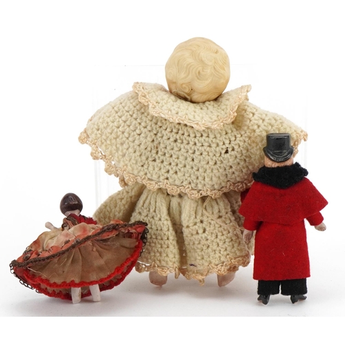 1456 - Three miniature bisque dolls with clothes, the largest 11cm high