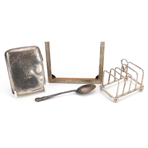 1817 - Silver objects comprising four slice toast rack, cigarette case, rectangular photo frame and a teasp... 