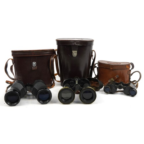 150 - Three pairs of military interest binoculars with cases including Barr & Stroud, Nippon Kogaku and Go... 