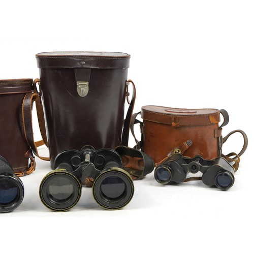 150 - Three pairs of military interest binoculars with cases including Barr & Stroud, Nippon Kogaku and Go... 