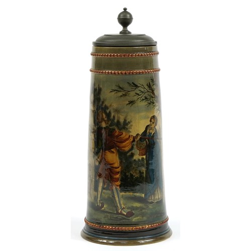 456 - Continental potttery beerstein with pewter lid, hand painted with figures, 37cm high