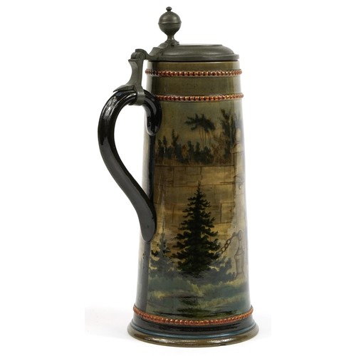 456 - Continental potttery beerstein with pewter lid, hand painted with figures, 37cm high