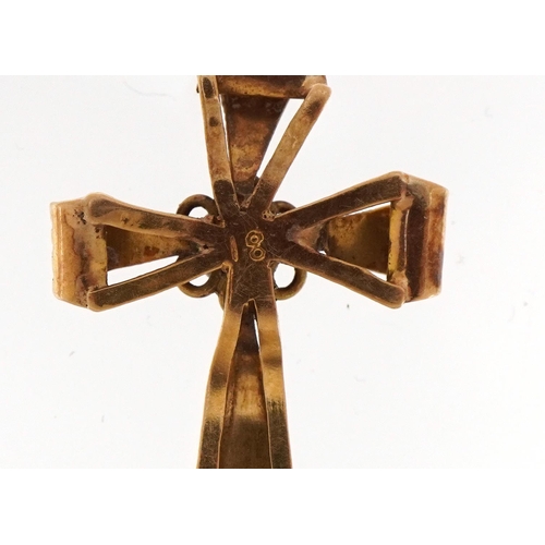 2109 - Antique 18ct gold cross pendant with engraved decoration set with a ruby, 2.6cm high, 1.1g