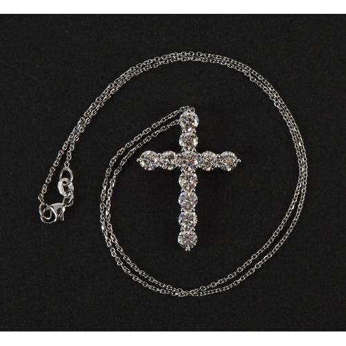 2066A - Large 18ct white gold diamond cross pendant on an 18ct white gold necklace, total diamond weight app... 
