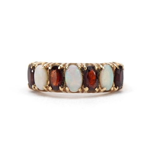 2078 - 9ct gold opal and garnet seven stone ring, size L, 2.5g