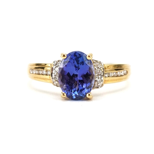 2106 - 18ct gold tanzanite ring with stepped diamond set shoulders, the tanzanite approximately 8.1mm x 6.0... 