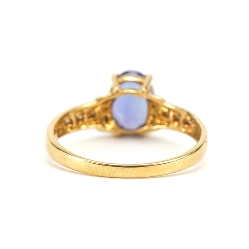 2106 - 18ct gold tanzanite ring with stepped diamond set shoulders, the tanzanite approximately 8.1mm x 6.0... 