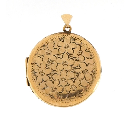 2075 - 9ct gold circular locket with engraved floral decoration, 4.5cm high, 12.5g