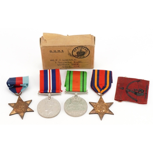 1754 - British military World War II medal group with box of issue inscribed T S Warren Hampden Park, Eastb... 