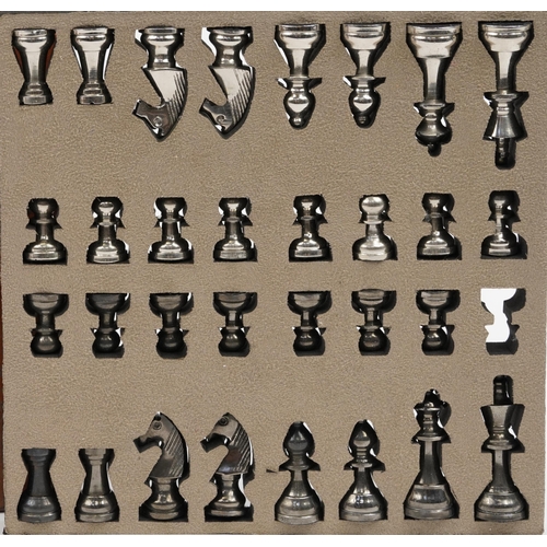 1448 - Tan leather cased travelling chess set with cast metal pieces, the largest piece 8cm high