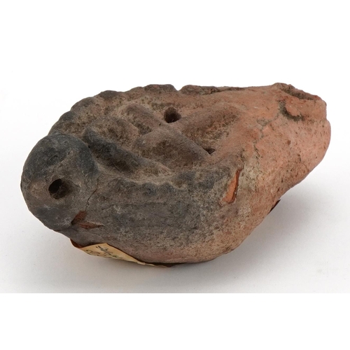 454 - Roman terracotta pottery lamp with provenance label to the base, 11cm in length