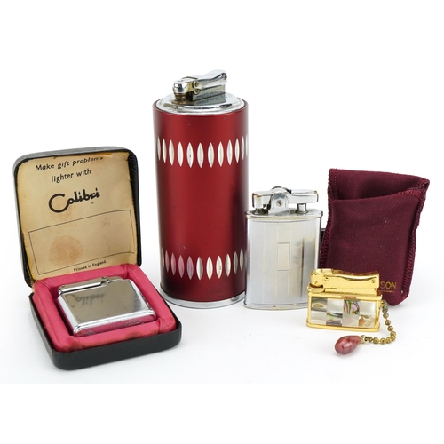 358 - Four vintage pocket and table lighters including Calibre and Ronson, the largest 12cm high