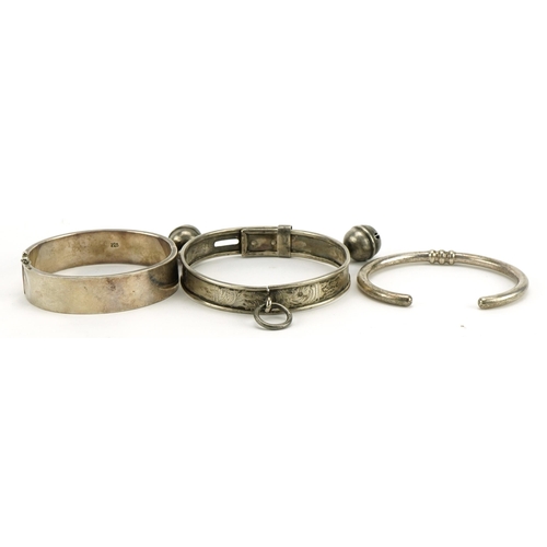 2581 - Three silver bangles and bracelets, one with bells, total 76.4g