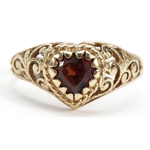 2584 - 9ct gold garnet love heart ring with pierced shoulders, size I/J, 1.4g