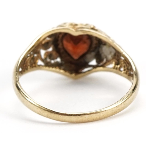 2584 - 9ct gold garnet love heart ring with pierced shoulders, size I/J, 1.4g