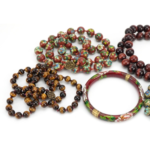 2625 - Two Chinese cloisonne bead necklaces, two tiger's eye bead necklaces and a cloisonne bangle