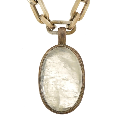 2611 - Heavy white metal necklace with large rock crystal pendant, 6cm high and 52cm in length, 158.0g