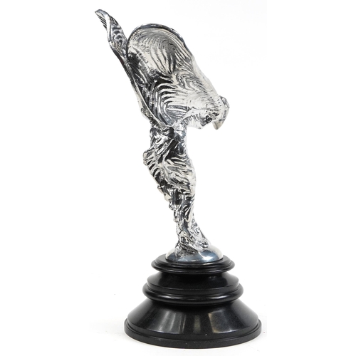 458 - Large silvered metal Spirit of Ecstasy raised on circular black marble base, 67cm high