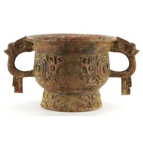 63 - Chinese patinated bronze archaic style censer with twin handles, character marks to the interior, 29... 