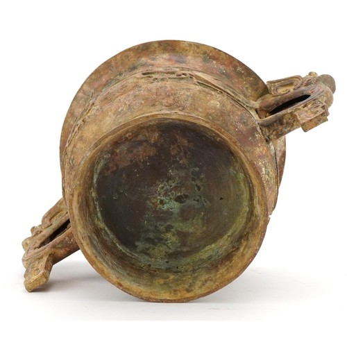 63 - Chinese patinated bronze archaic style censer with twin handles, character marks to the interior, 29... 