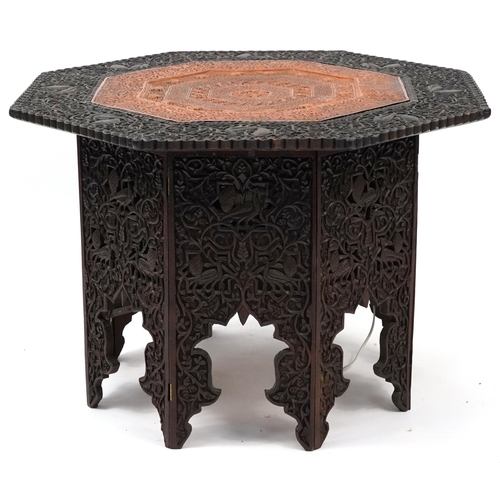 862 - Anglo Indian octagonal oak lamp table profusely carved with birds and fish amongst foliage, 60cm H x... 