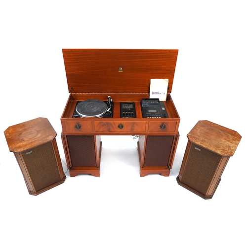 855 - Yew twin pedestal desk gramophone cabinet housing a Garrard SP25MKV turntable, Dynatron tuner amplif... 