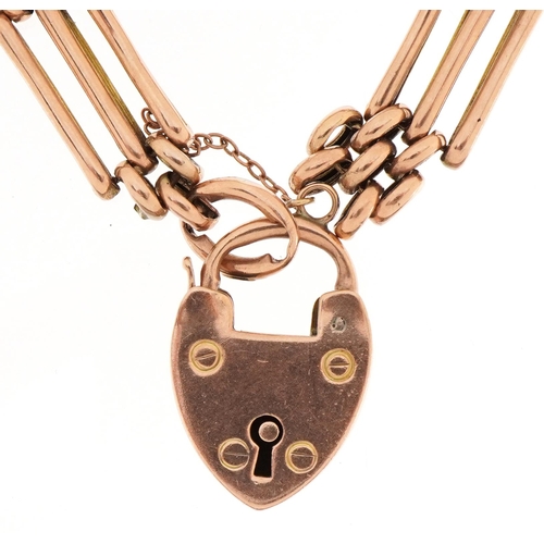 2084 - 9ct rose gold three row gate link bracelet and love heart padlock, 17cm in length, 12.7g