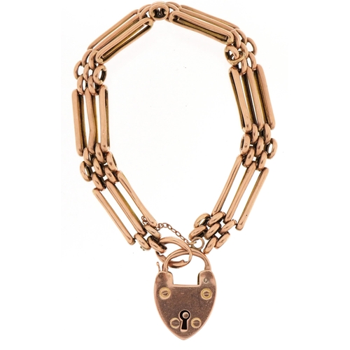 2084 - 9ct rose gold three row gate link bracelet and love heart padlock, 17cm in length, 12.7g