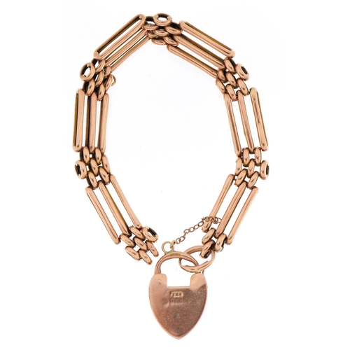 2084 - 9ct rose gold three row gate link bracelet and love heart padlock, 17cm in length, 12.7g