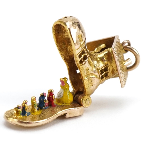 2100 - 9ct gold shoe charm opening to reveal enamelled figures, 1.5cm high, 3.8g