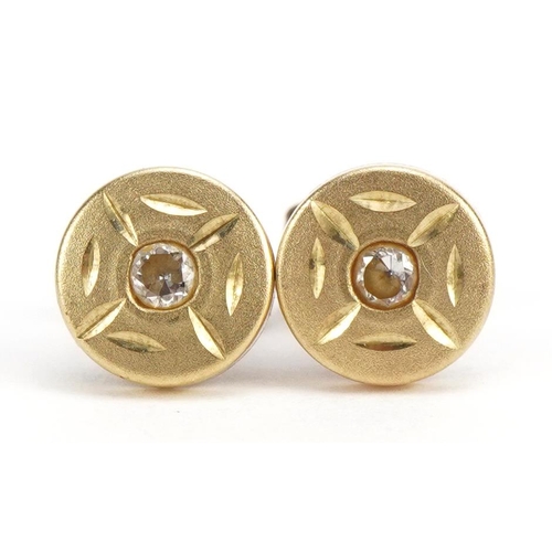 2582 - Pair of yellow metal clear stone stud earrings, 6.4mm in diameter, 0.5g