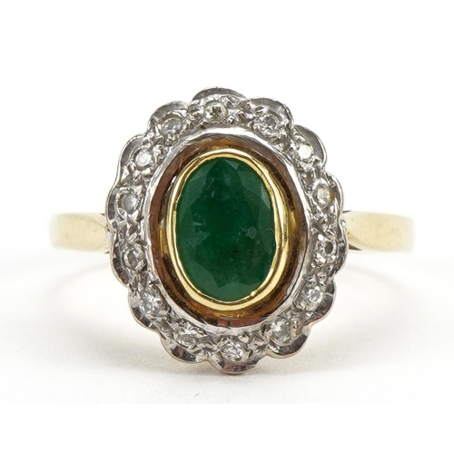 2058 - 18ct gold emerald and diamond cluster ring, the emerald approximately 6.7mm x 4.6mm, London 1988, si... 