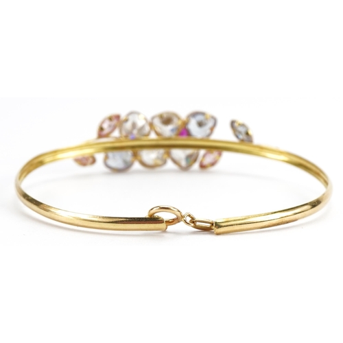 2102 - 18ct gold clear, pink stone and ruby double flower head bracelet, 6cm wide, 6.2g