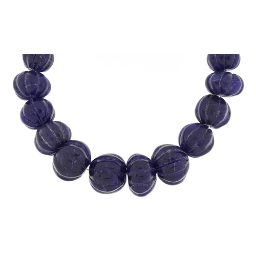 2585 - Large carved blue onyx bead necklace with adjustable cord, total blue onyx weight approximately 875 ... 