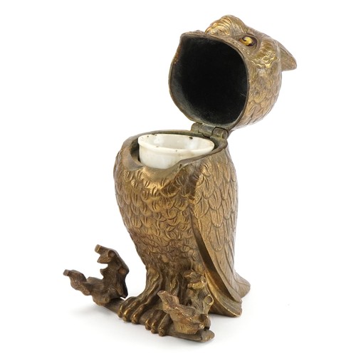 428 - Victorian bronze inkwell in the form of an owl with beaded eyes having a hinged lid house a ceramic ... 