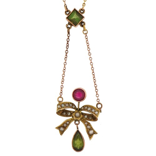 2053 - Victorian unmarked gold green stone, ruby and seed pearl bow design necklace, the green stone possib... 