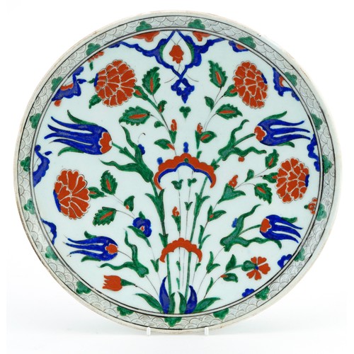 36 - Turkish Ottoman Iznik pottery plate hand painted with flowers, 31cm in diameter