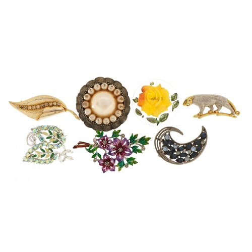 2596 - Seven vintage costume jewellery brooches including plastic rose and a leopard, the largest 7cm wide