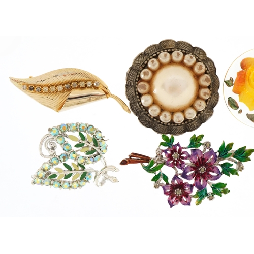 2596 - Seven vintage costume jewellery brooches including plastic rose and a leopard, the largest 7cm wide