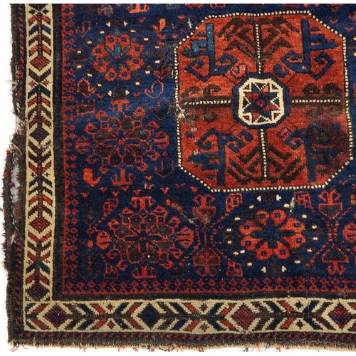 495 - Afghan red and blue ground Belutch rug with all over geometric design, 86cm x 76cm