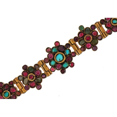 2063 - Continental gilt metal flower head multigem bracelet, set with colouful stones including rubies, eme... 