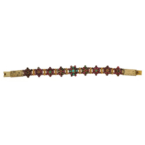 2063 - Continental gilt metal flower head multigem bracelet, set with colouful stones including rubies, eme... 